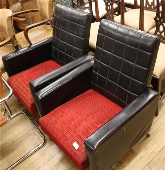 A pair of black and red 1960s armchairs
